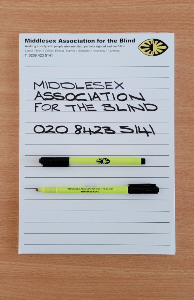 An image of an A4 notepad with thick black lines and two MAB marker pens resting on the A4 notepad